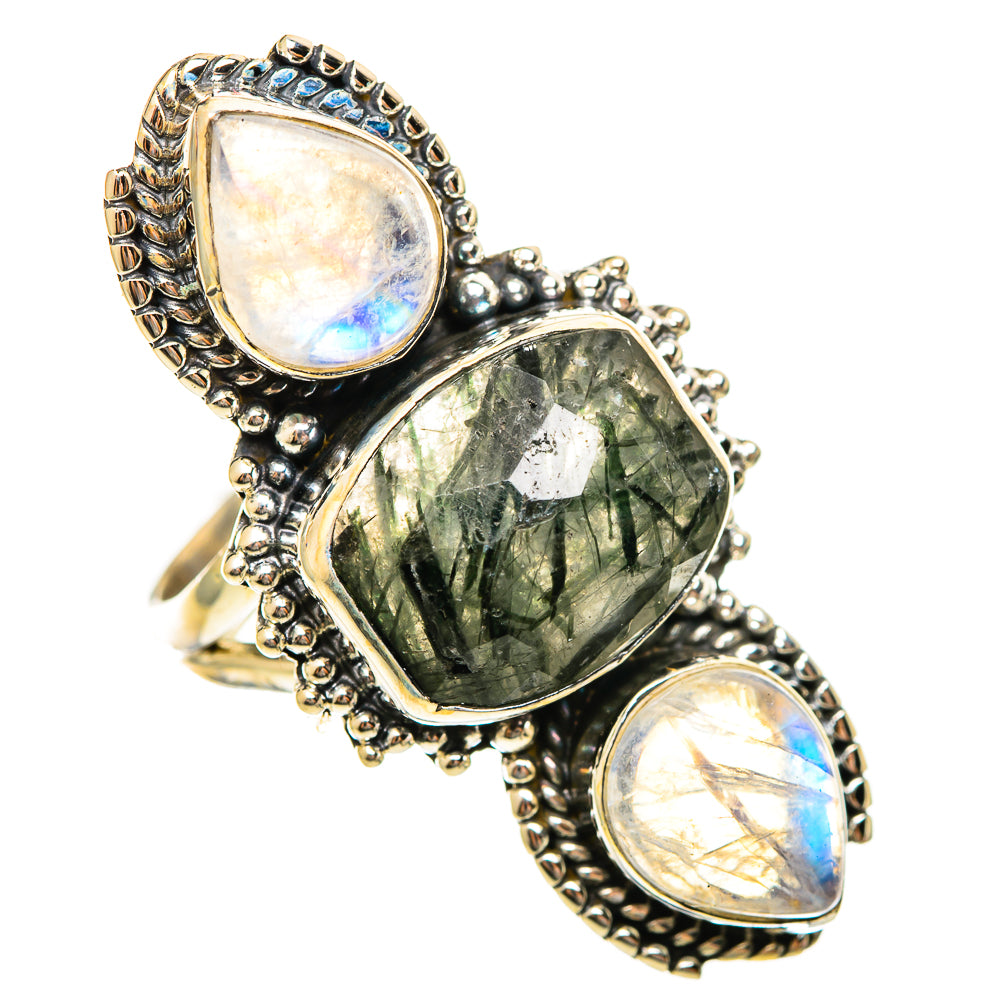 Sterling silver statement ring with large green faceted center stone and two moonstone accents.