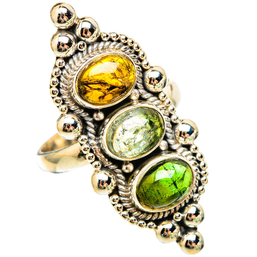 Sterling silver ring with three round tourmalines: amber and two greens, beaded border.