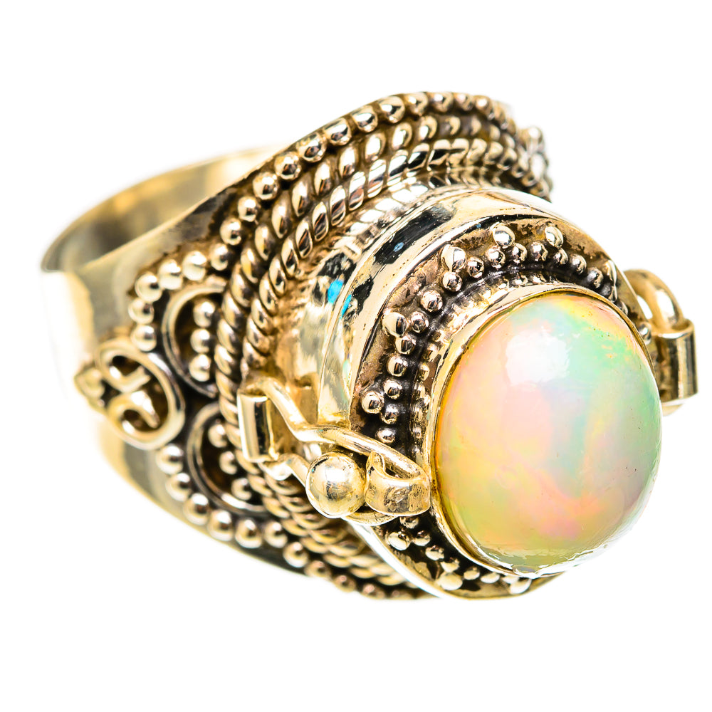 Round opal cabochon ring with ornate halo and side band detail in 925 sterling silver