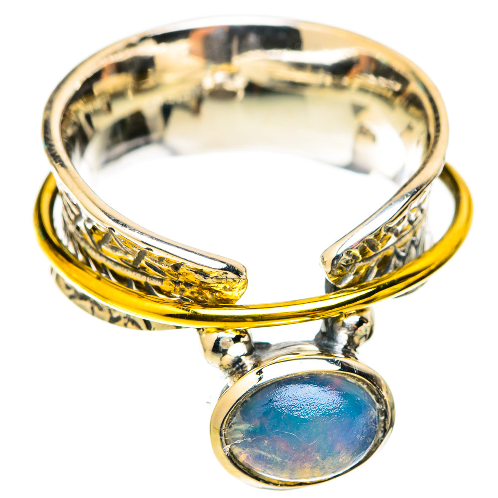 Oval Ethiopian opal charm ring with gold-toned and silver bands, open top view