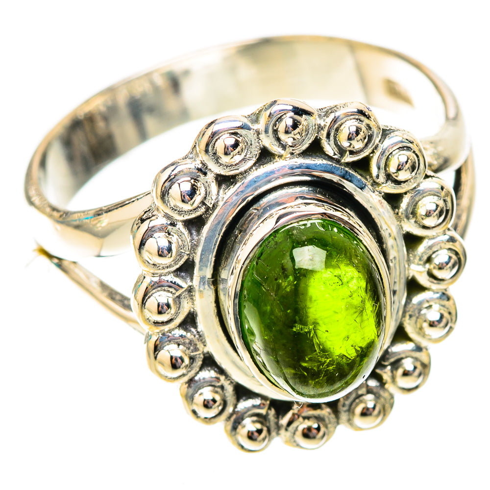 Oval green tourmaline in ornate beaded halo on sterling silver ring band