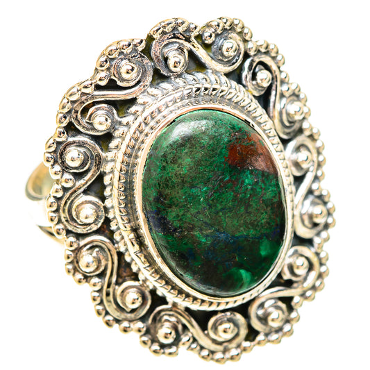 Oval green stone ring in detailed silver filigree with raised bezel setting