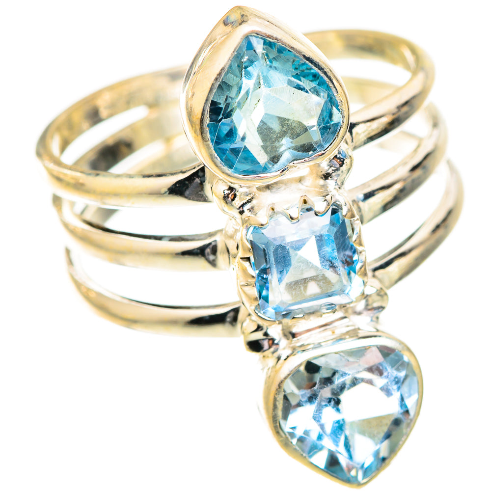 Three-stone blue gemstone ring with teardrop and oval cuts, gold-tone band view
