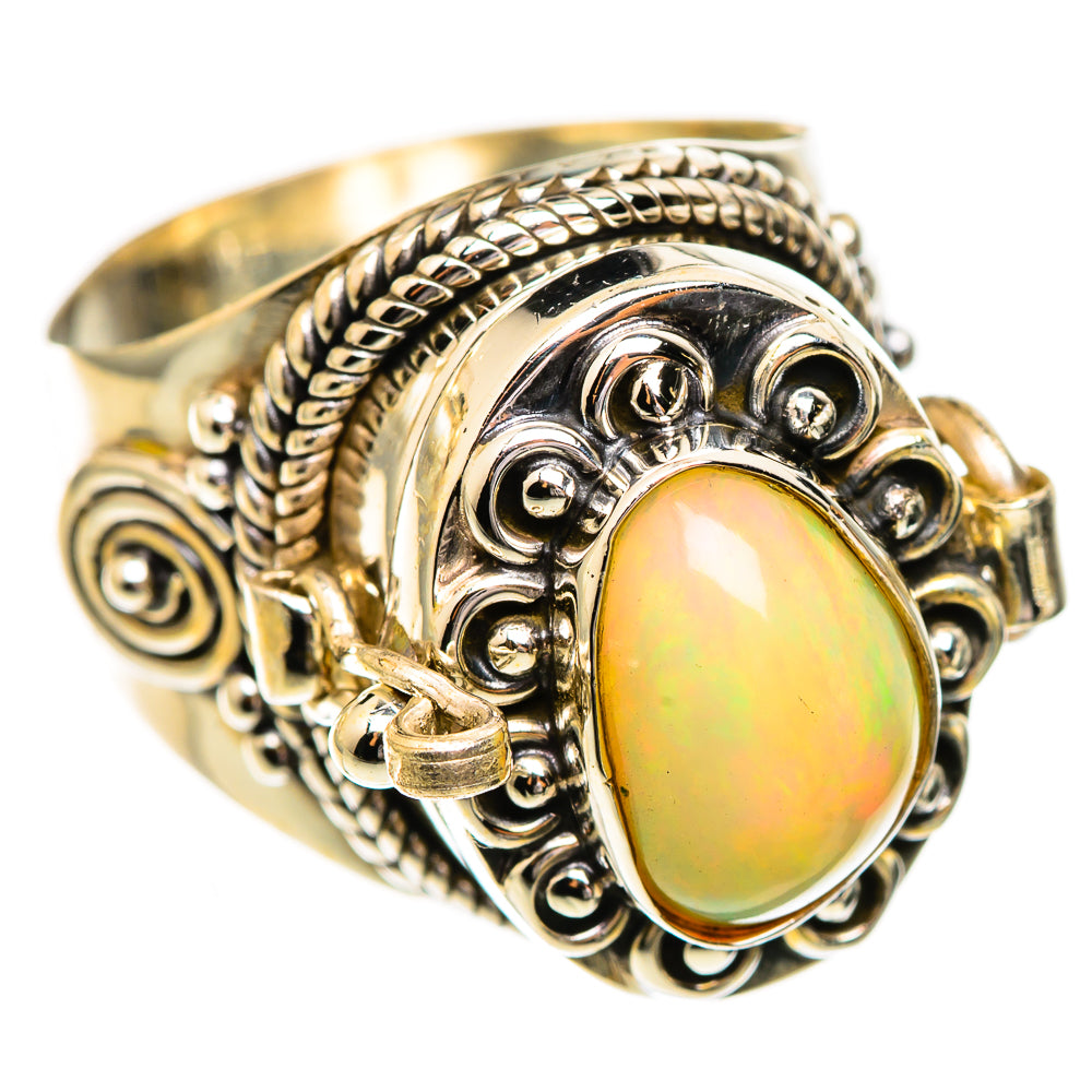 Sterling silver ring with oval opal cabochon, raised filigree and textured band