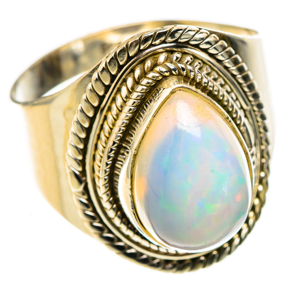 Oval opal cabochon ring in 925 sterling silver, ornate braided oval frame