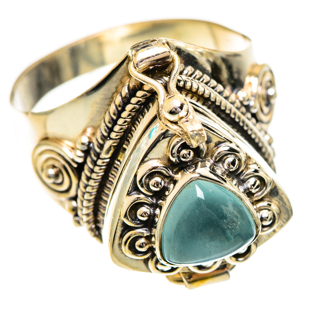 Silver-tone ring featuring a teardrop aquamarine gemstone and filigree scrollwork