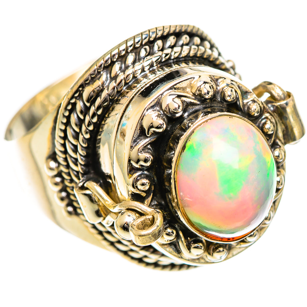 Sterling silver opal ring with oval Ethiopian opal and ornate filigree bezel