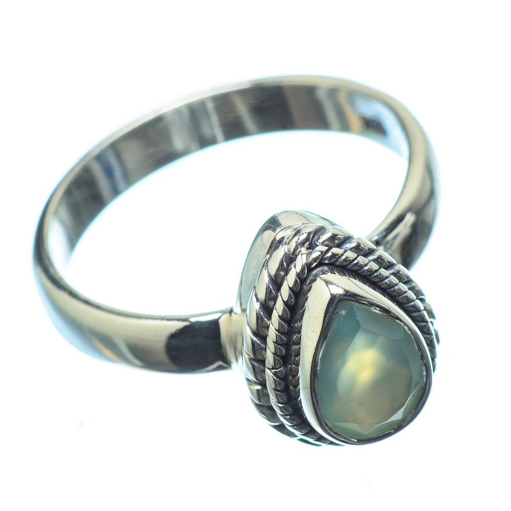 Polished sterling silver ring with oval opal cabochon and braided bezel, size 6.25