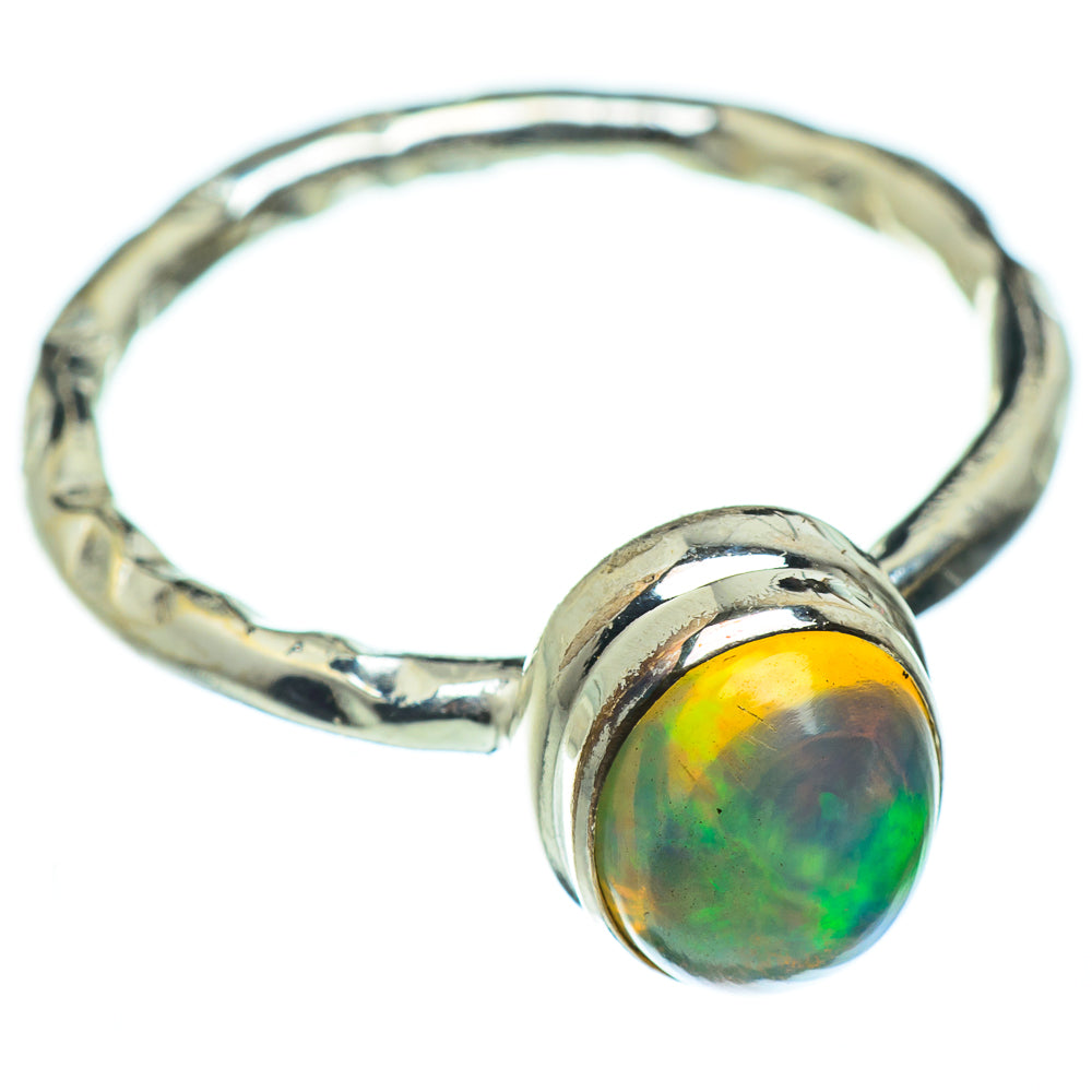 Sterling silver opal ring with round cabochon opal set on textured band