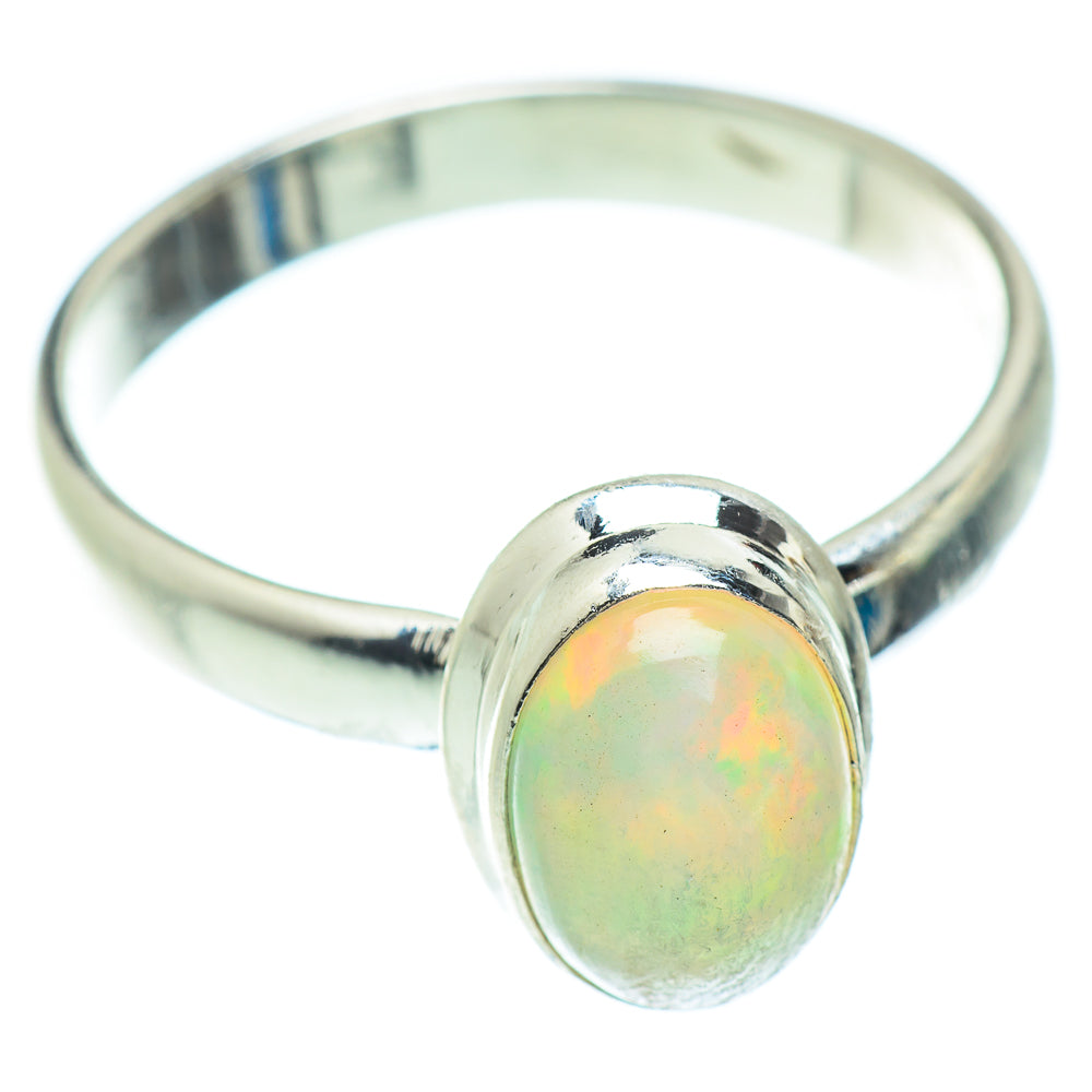 Sterling silver opal ring with round-oval opal cabochon and polished band