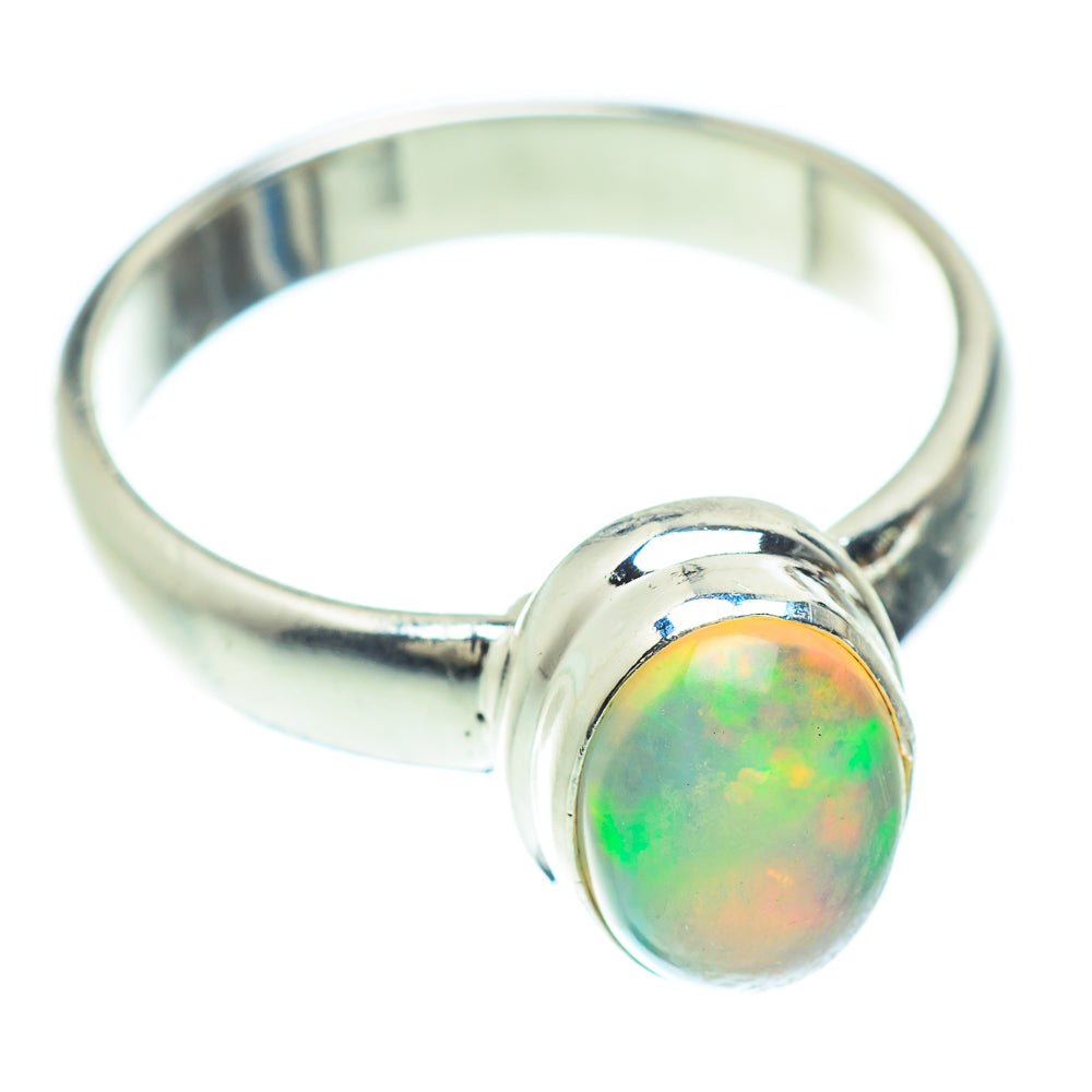 Sterling silver ring with oval natural opal cabochon, green-orange iridescence