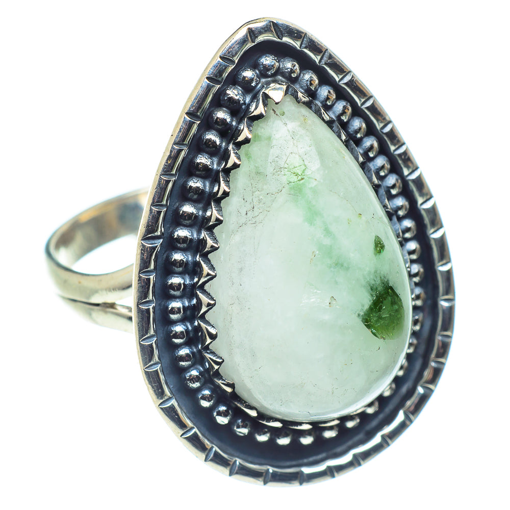 Sterling silver oval ring with large pale green gemstone, textured dark bezel