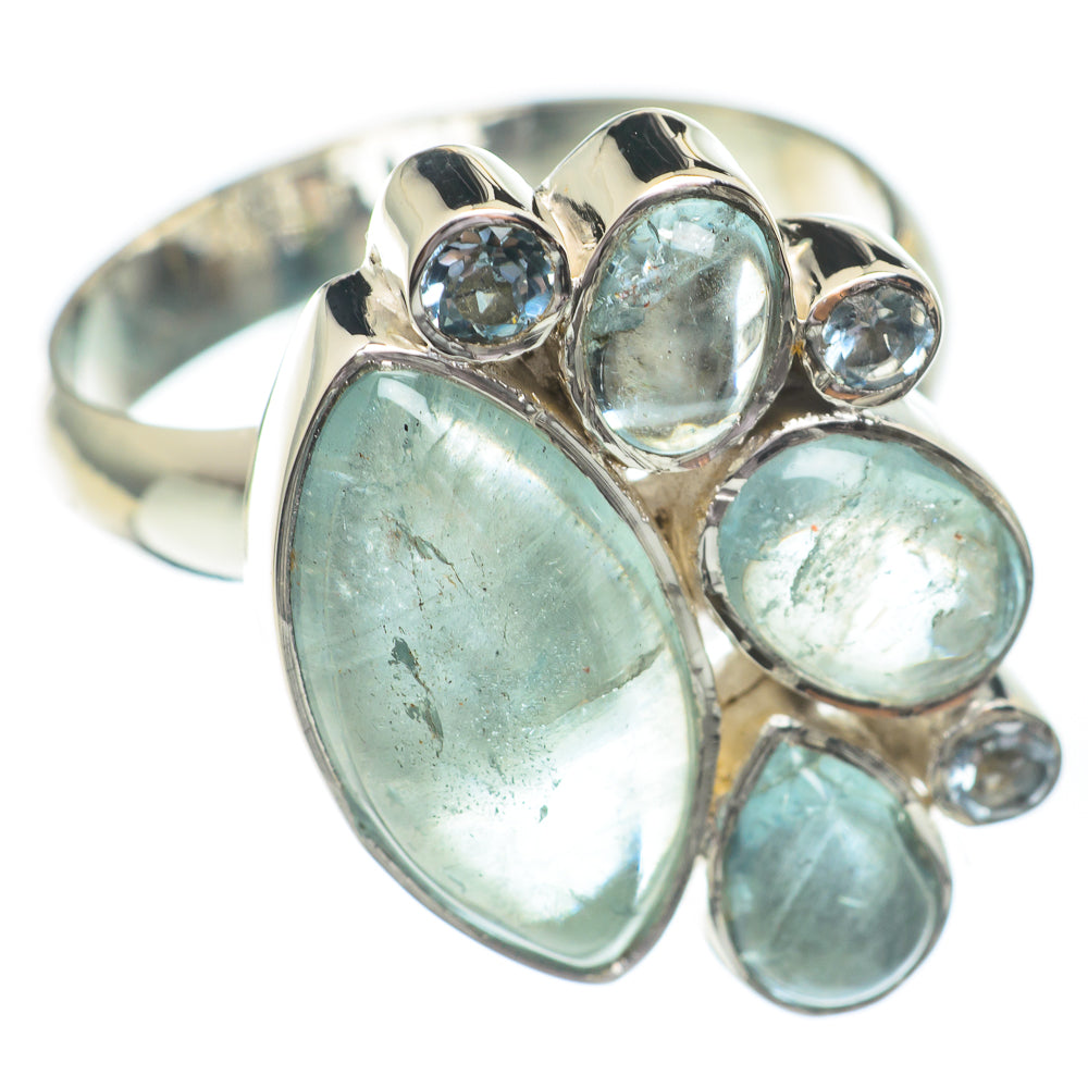 Adjustable sterling silver ring with large oval aquamarine blue center stone and smaller rounds