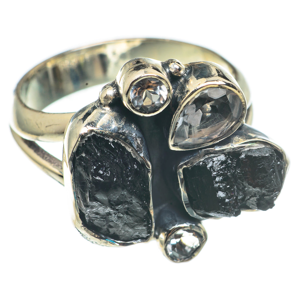 Silver ring set with rough black onyx and three clear round stones