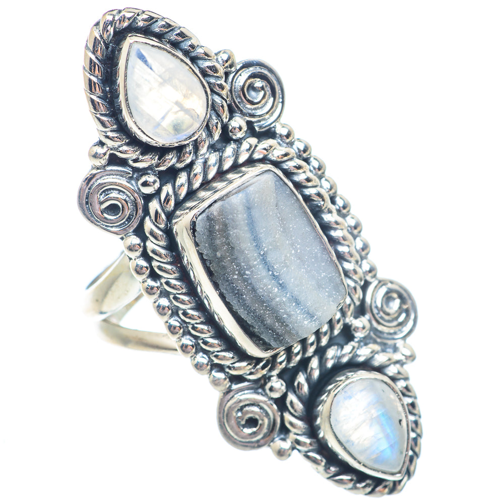Sterling silver ring with three iridescent cabochon stones in blue-gray and white