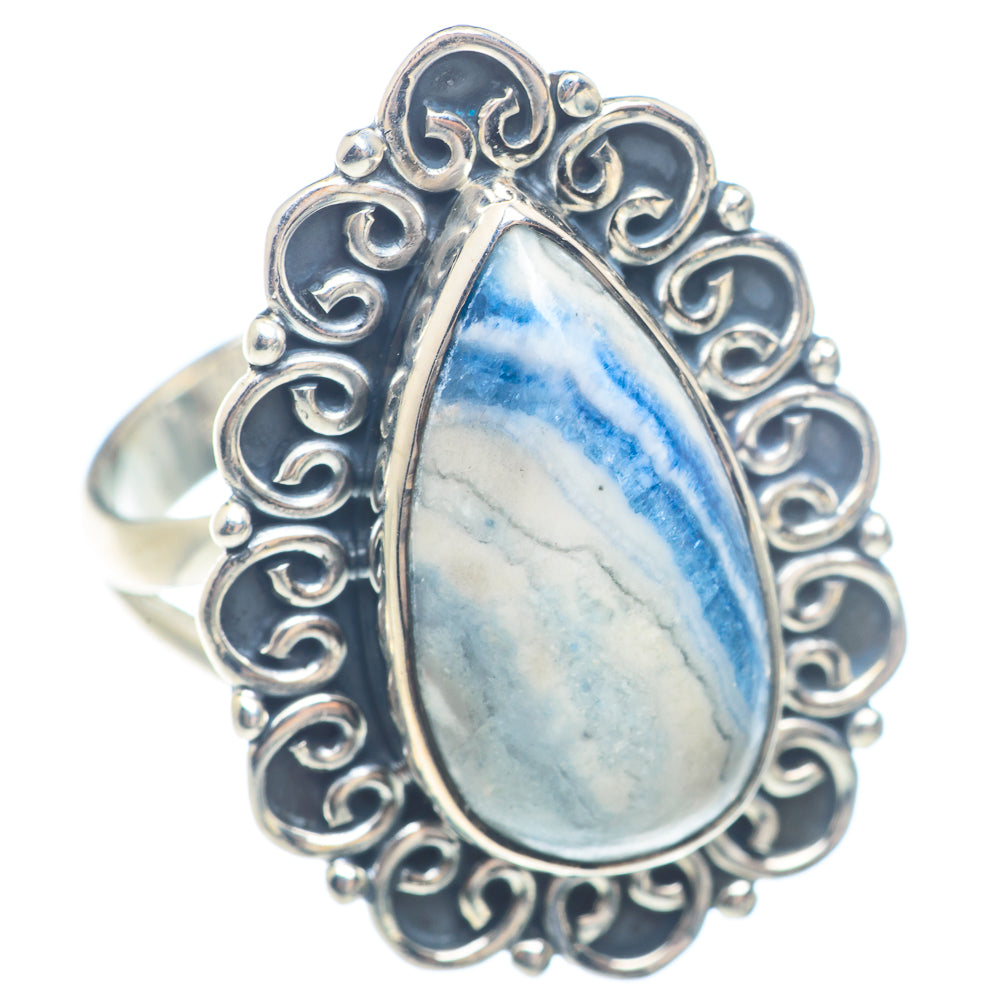 Sterling silver ring with blue teardrop gemstone and ornate openwork border