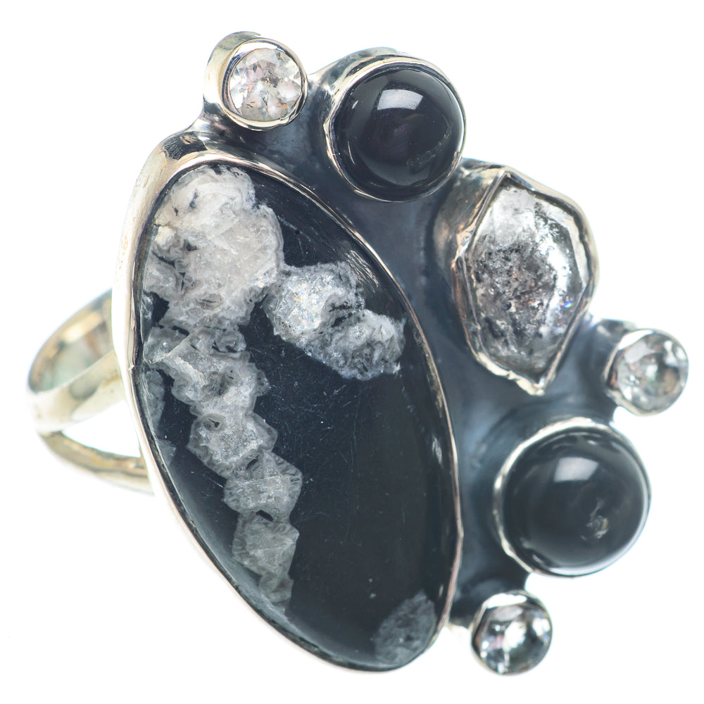 Sterling silver gemstone ring with large black oval cabochon and round black accents