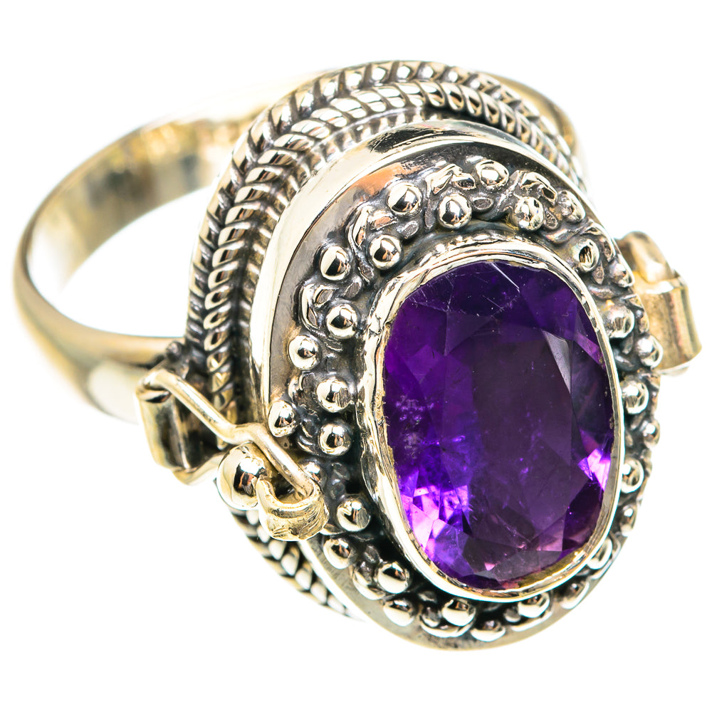 Silver ring with oval purple faceted amethyst in an engraved, raised bezel