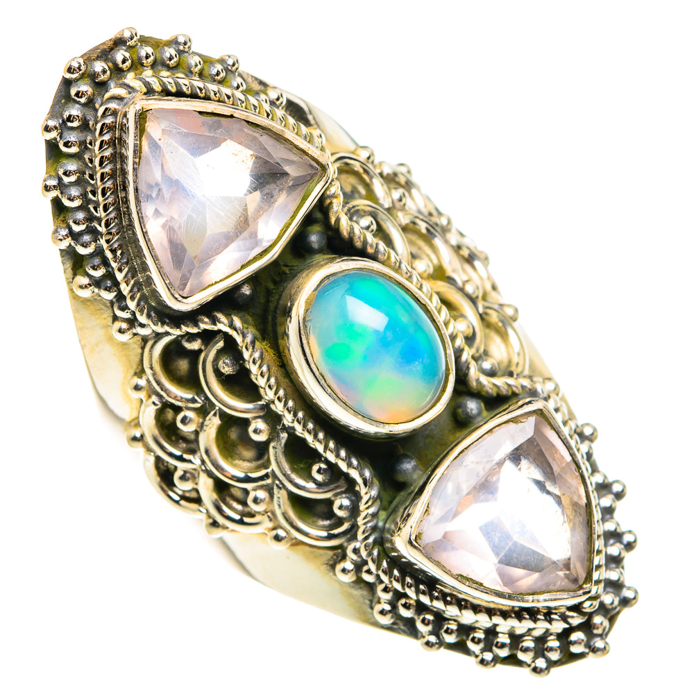 Ornate sterling silver ring with two triangle stones and blue-green oval opal