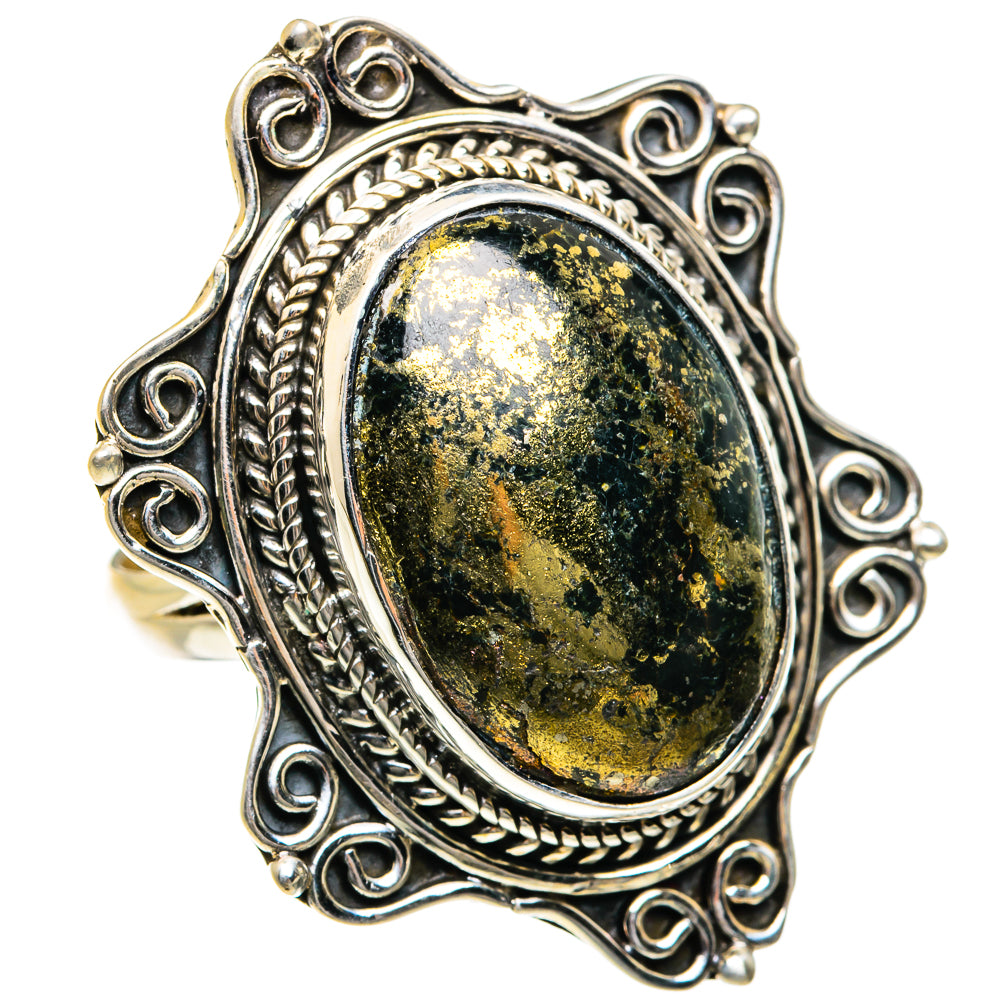 Silver ring with oval dark green-gold speckled gemstone in raised bezel with braided border