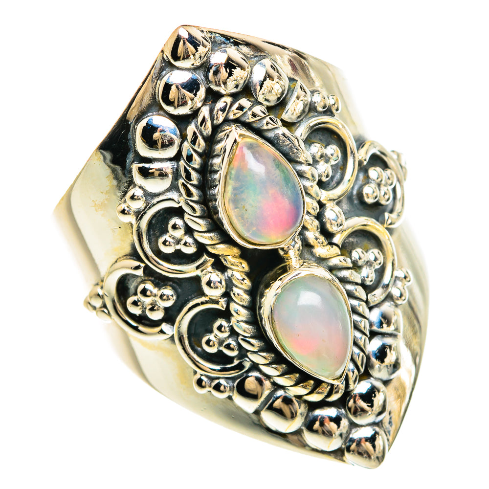 Sterling silver filigree ring with two oval opal cabochons, iridescent pink-green