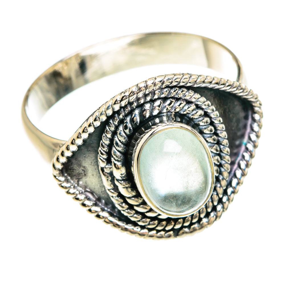 Sterling silver ring with oval pale aquamarine stone and textured rope setting, open-back view