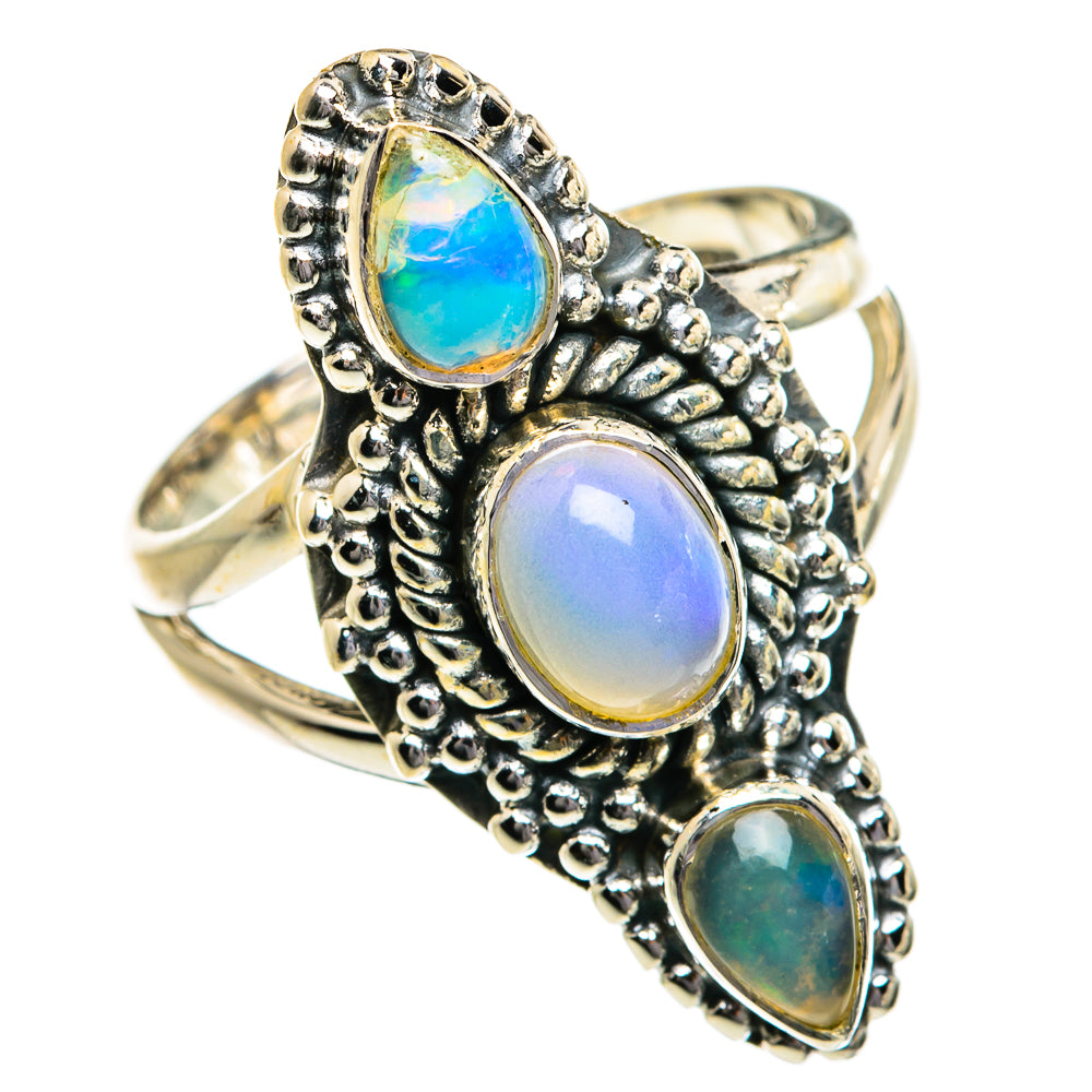 Sterling silver opal ring with three oval gemstones, blue, opal white, and green tones
