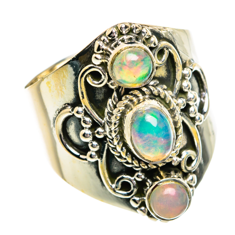 Sterling silver opal ring with three oval opals in ornate filigree bezel