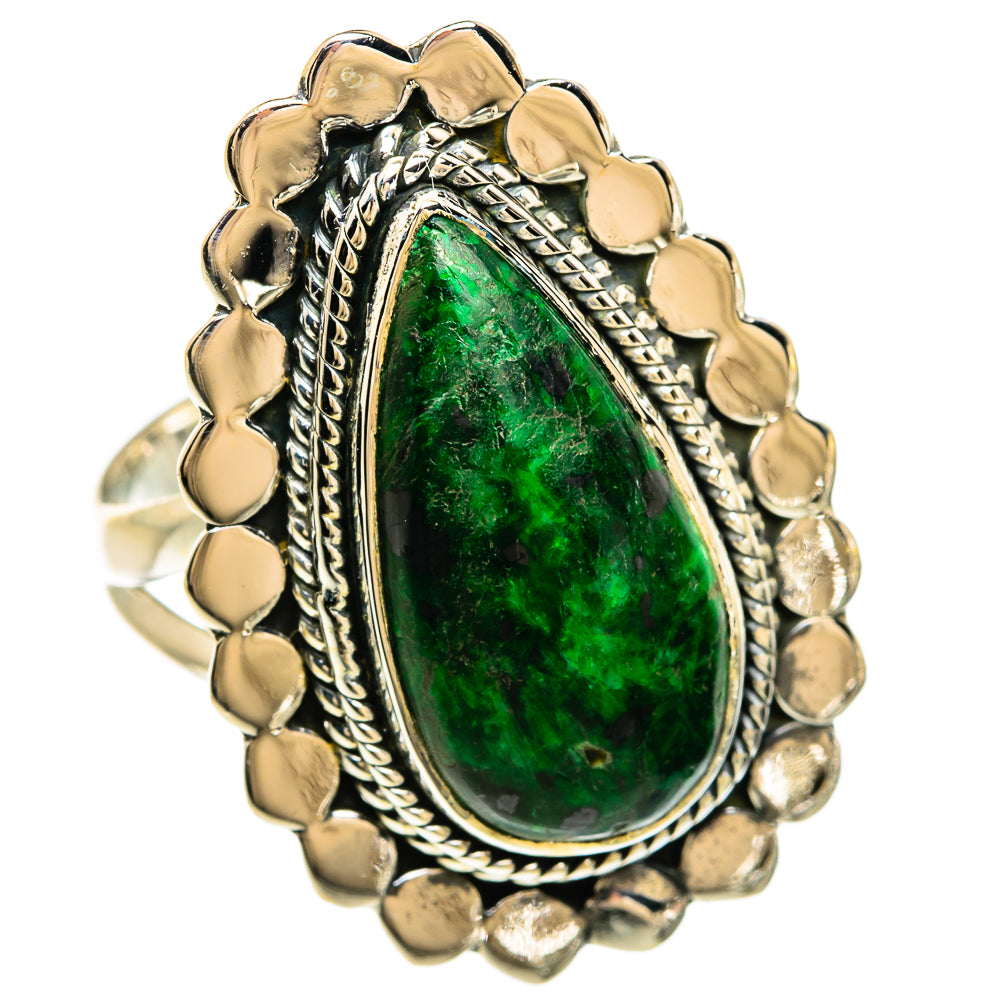 Sterling silver ring with large green oval stone and ornate scalloped border