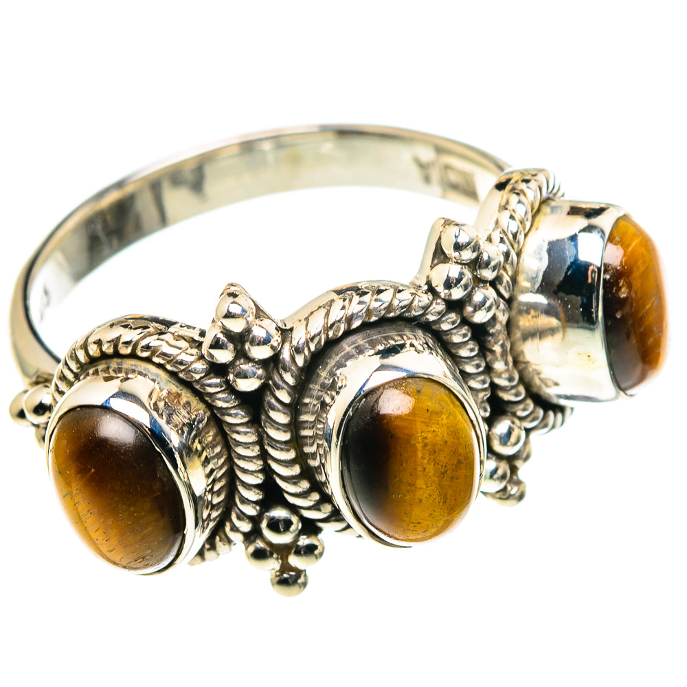 Tiger eye cabochon ring with three round amber stones and silver twisted bead setting