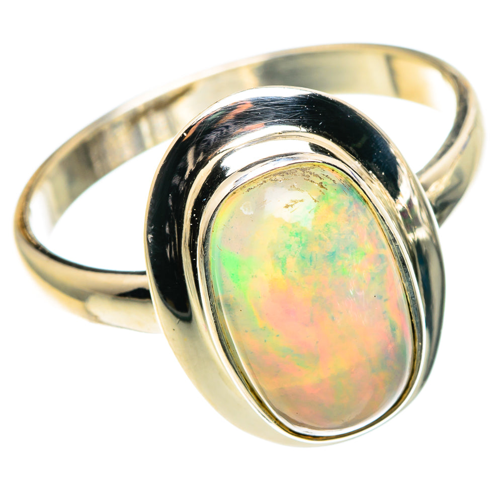 Sterling silver opal ring with oval Ethiopian opal center and dark bezel, polished band