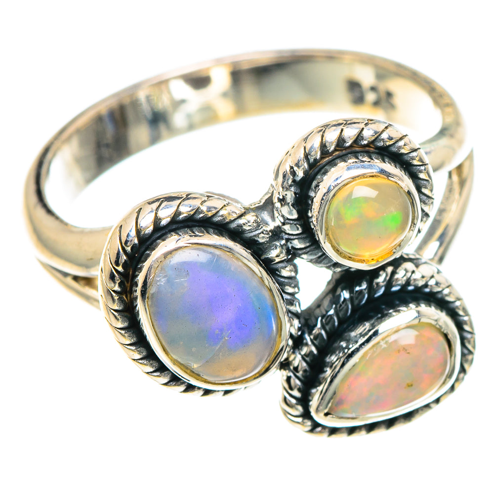 Sterling silver opal ring with three round/oval Ethiopian opal stones, ornate twisted bezel