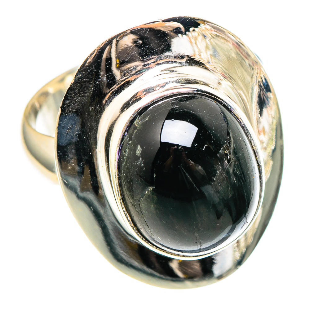Sterling silver ring with oval black gemstone and twisted bezel detail