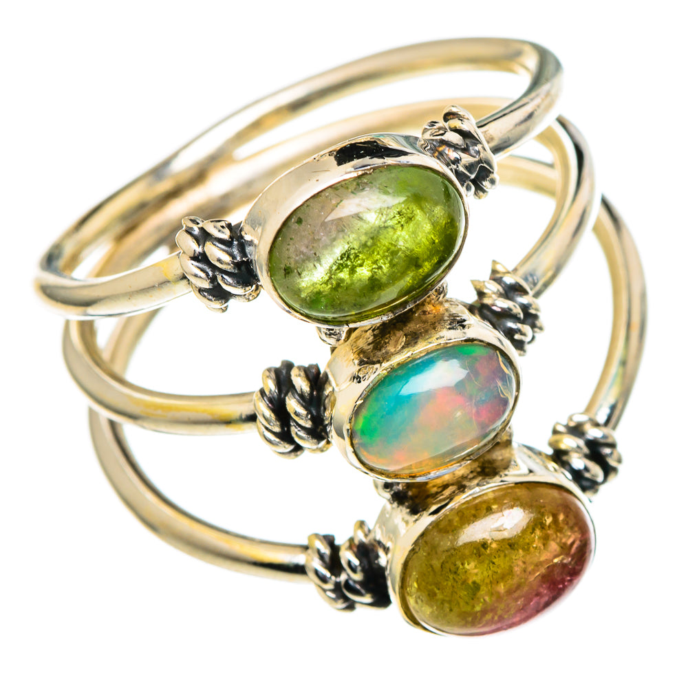 Silver oval gemstone ring with stacked green, iridescent opal, and yellow-green stones