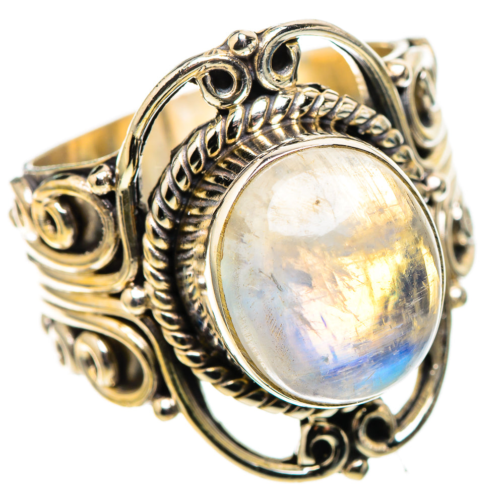 Sterling silver ring with oval moonstone bezel and swirling decorative band