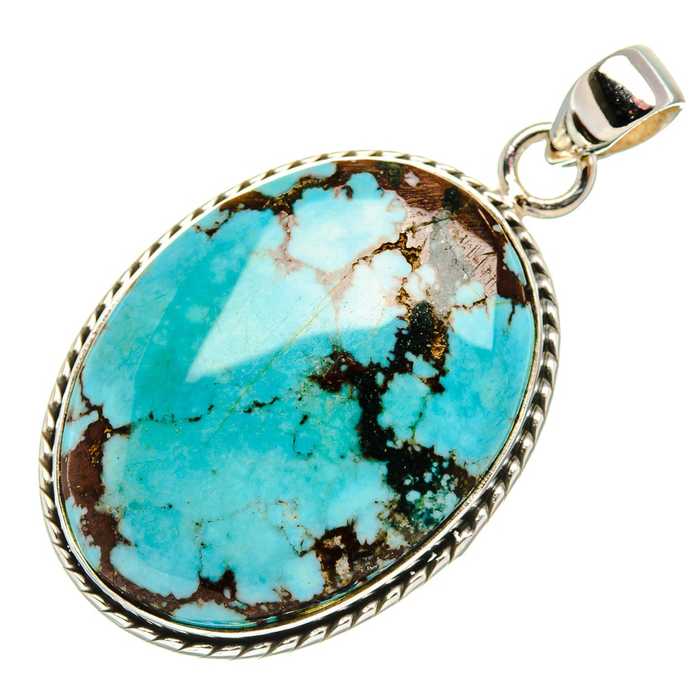 Oval turquoise gemstone pendant with engraved silver frame and bail loop