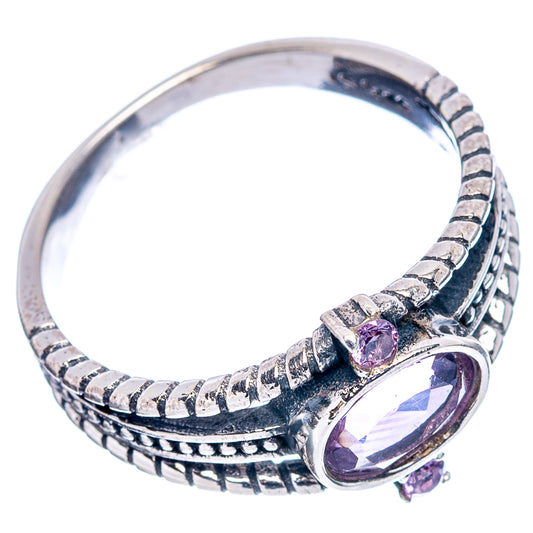 Amethyst oval sterling silver ring with patterned split band and purple gemstone