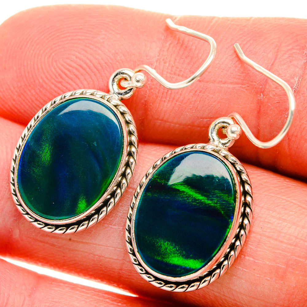 Sterling silver opal drop earrings with oval blue-green iridescent stones, ornate bezel
