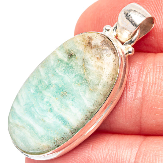 Oval blue aragonite pendant in .925 sterling silver bezel with hinged bail