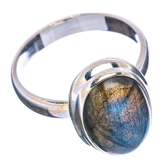 Sterling silver oval labradorite ring with shiny bezel setting, blue-gold shimmer stone