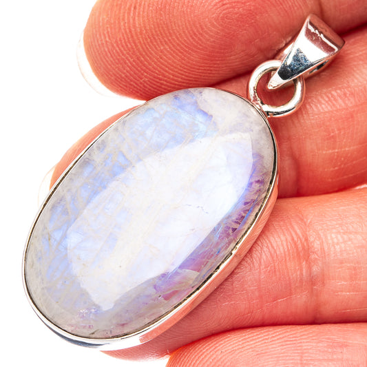 Oval rainbow moonstone pendant in .925 sterling silver bezel with loop bail