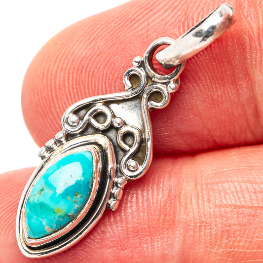 Sterling silver turquoise pendant with oval stone and ornate filigree setting