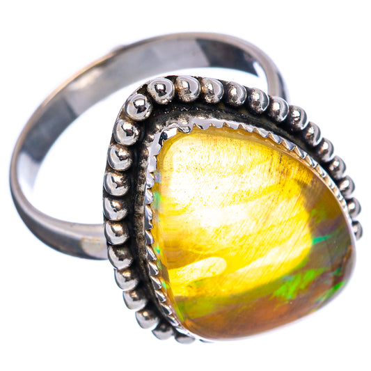 Sterling silver opal ring with oval yellow opalescent stone and beaded bezel