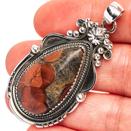 Obsidian pendant, oval dark stone bezel in .925 sterling silver with ornate bail and border