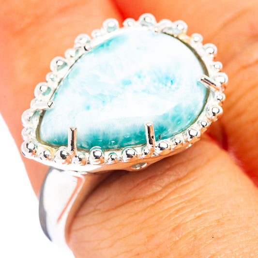 Sterling silver Larimar oval ring with blue gemstone bezel and bead halo