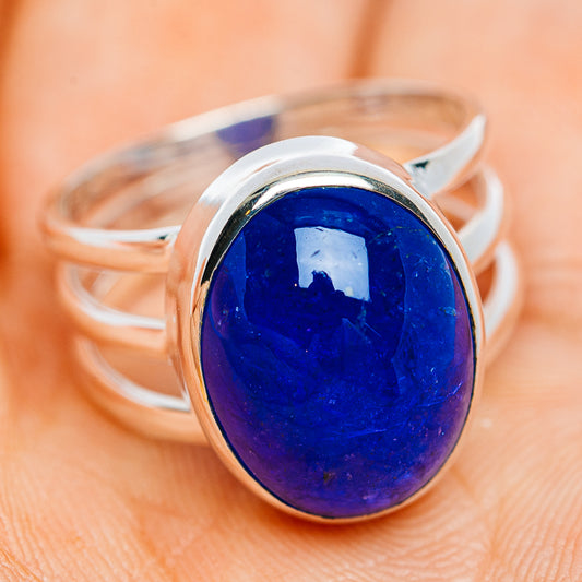 Sterling silver ring with large oval blue gemstone in bezel setting