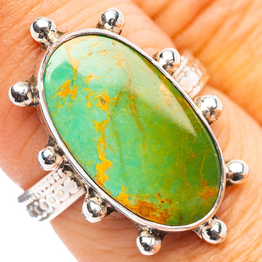 Sterling silver oval turquoise ring with six bead prongs and bright green blue stone