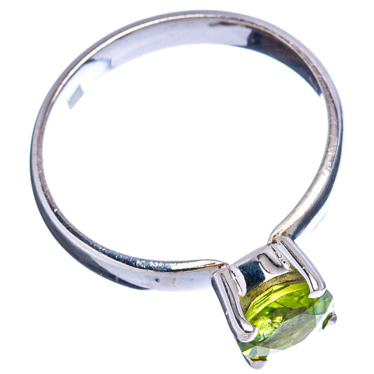 Sterling silver peridot ring with faceted oval green gemstone, open prong setting