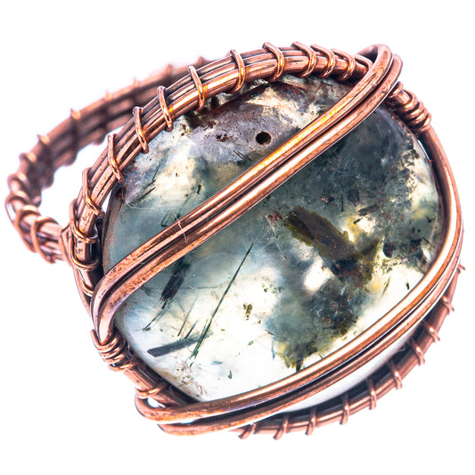 Oxidized copper wire ring with oval prehnite gemstone, bead-wrapped border