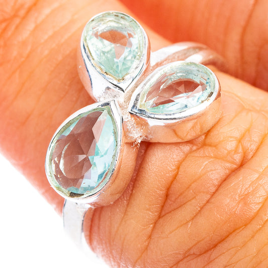 Sterling silver ring with three light blue oval stones in a clustered design